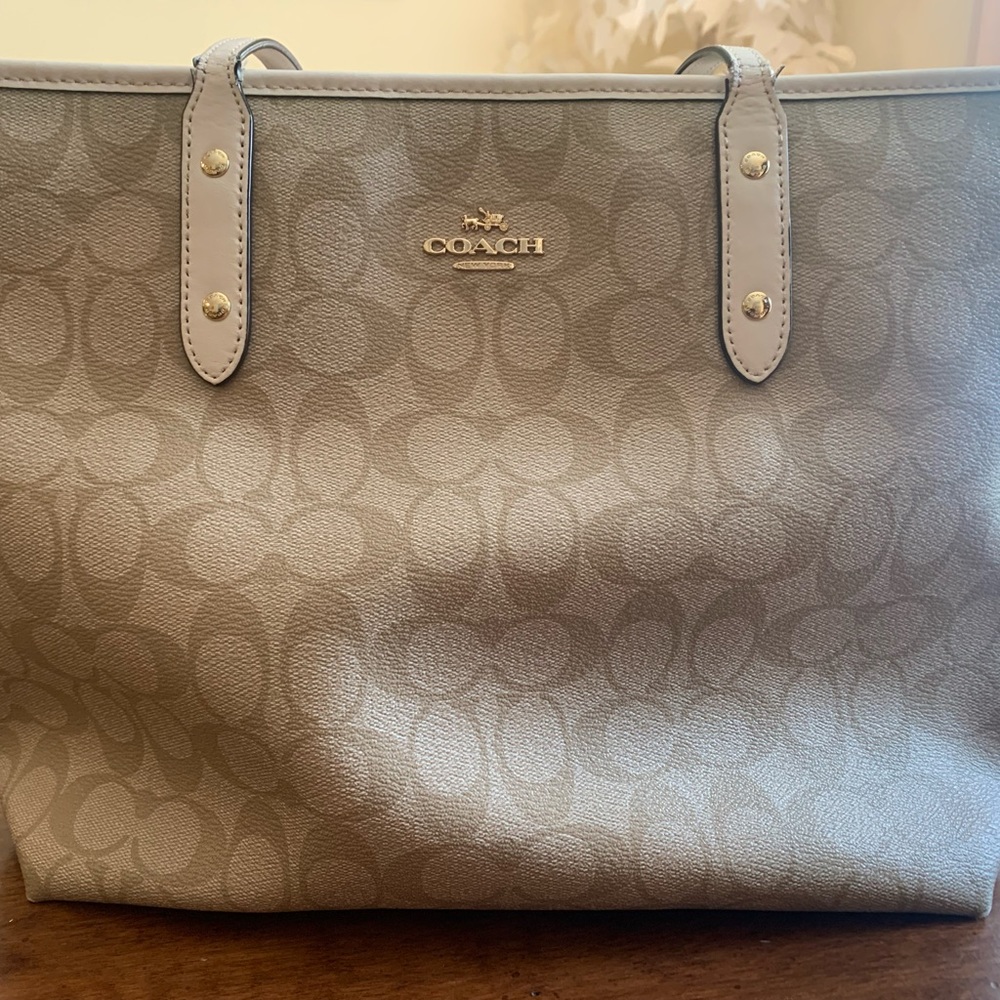 White and tan large coach purse worn out on handles but works the same